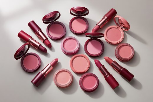 Artistic flat-lay pairing satin lipsticks alongside matching powder and cream blush compacts